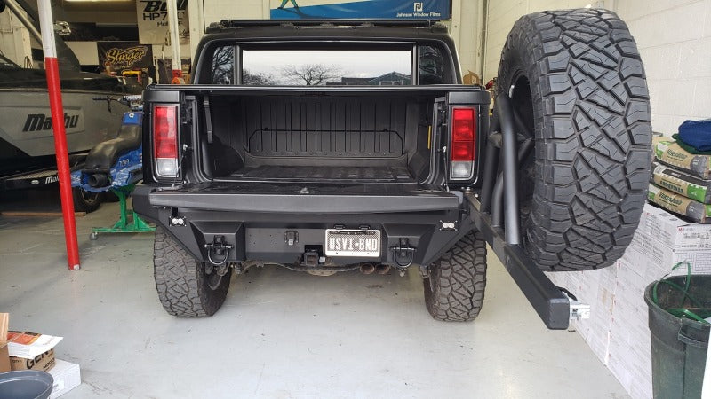 Road Armor 03-09 Hummer H2 Dakar Rear Non-Winch Bumper w/Tire Carrier - Raw
