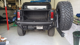 Road Armor 03-09 Hummer H2 Dakar Rear Non-Winch Bumper w/Tire Carrier - Tex Blk