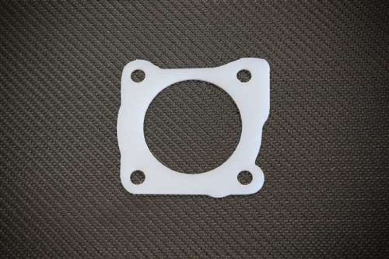 Torque Solution Thermal Throttle Body Gasket: DSM Eclipse / Talon / Laser 1st Gen 4G63 Turbo Only